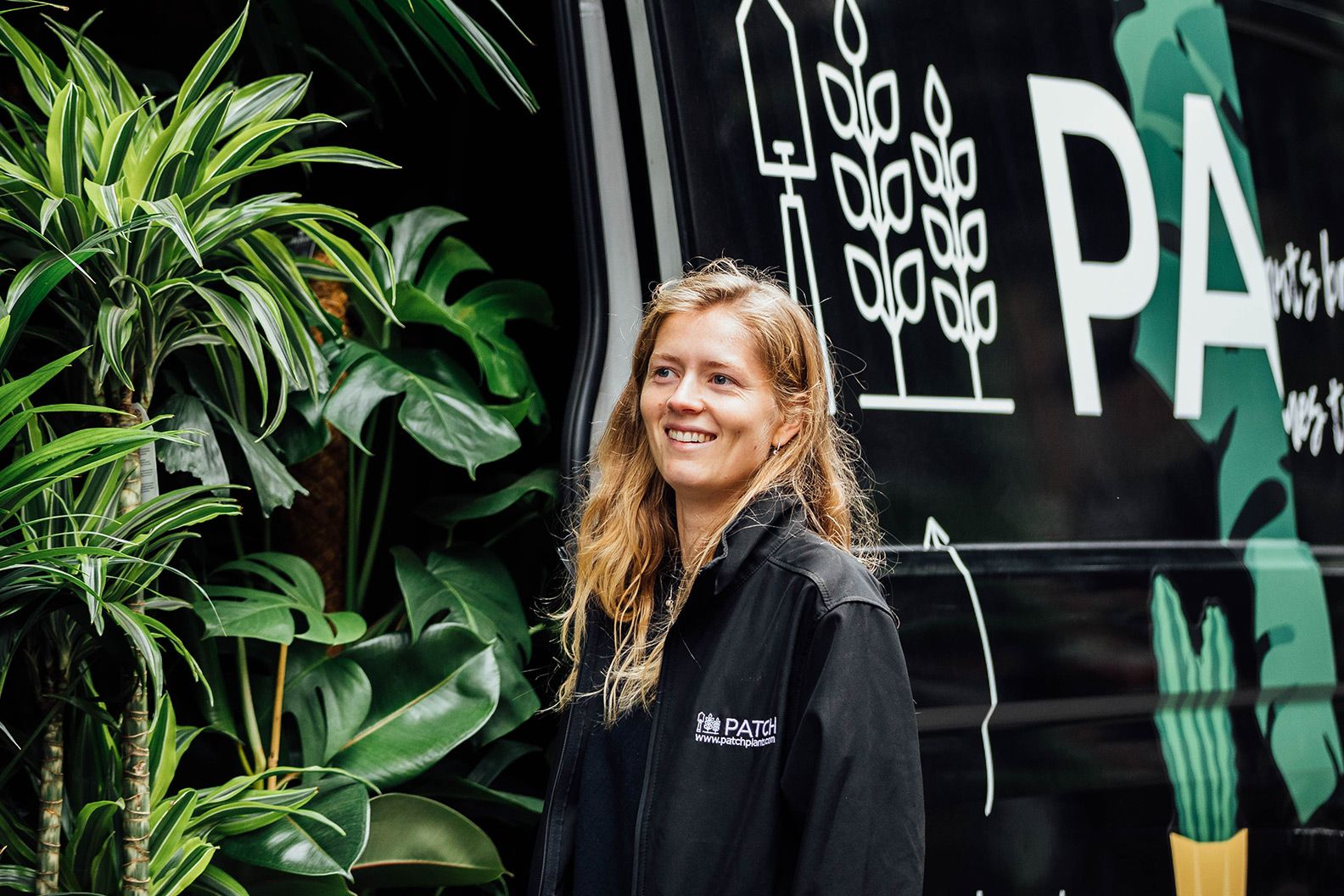 Member of the Patch team with a Patch-branded delivery van