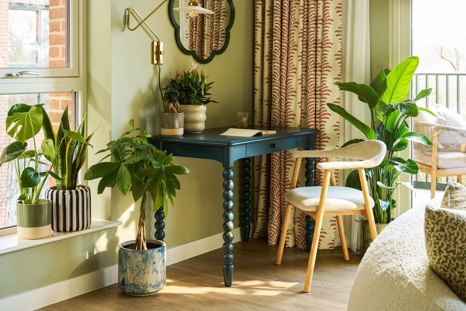 A home office set-up decorated with plants